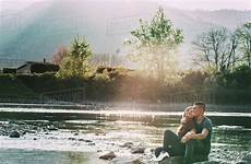 river sitting beside couple romantic smiling rocks dissolve stock royalty d943