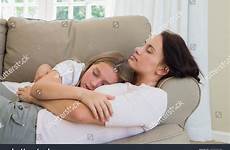 daughter sleeping mother sofa shutterstock stock
