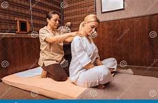masseuse massaging clients massage