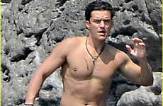 orlando bloom shirtless perry katy muscles again strips down beach display puts goes his today hot big picture italy size