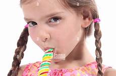 sucking candy stick girl alamy