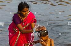 bathing indian river son mother his alamy india waters tungabhadra stock hampi