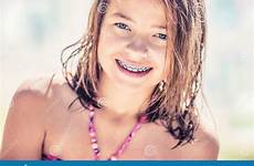 bikini teen braces young girl cute little pretty teeth dental portrait stock sunny day