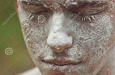 dirty face man mud soiled horror portrait stock