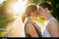 kissing girls teenage teen couple alamy two stock dirt bright against sun road
