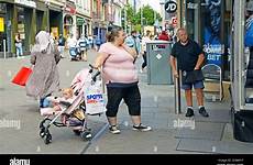 fat lady alamy stock masks vendor buying face street very