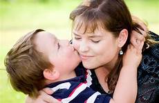 mother son kissing stock
