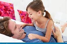 daughter bed father lying together stock dreamstime