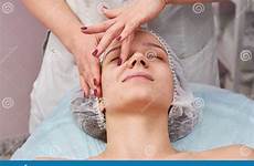 massaged getting face young woman caucasian masseuse working women girl stock