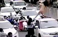 naked car woman top dances traffic jam driver causing brutally her yanks ankle down before off
