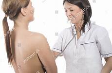 doctor breast examination female performing stock shutterstock