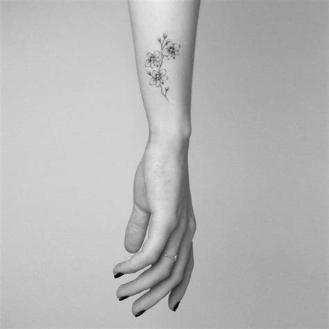 It's dainty and easy on the eyes, plus, you can hide it effortlessly if the need arises. Small Branch Of Orchid Tattoo On Forearm in 2020 | Dainty ...