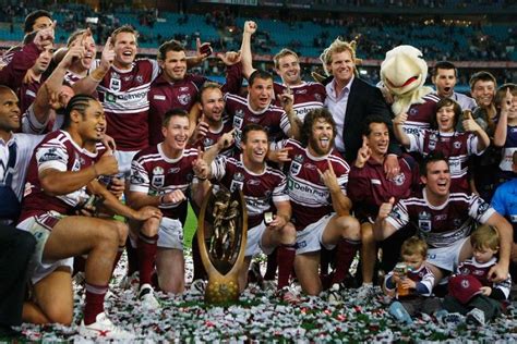 Australian rugby league football club. Manly Sea Eagles players celebrate with the trophy after ...