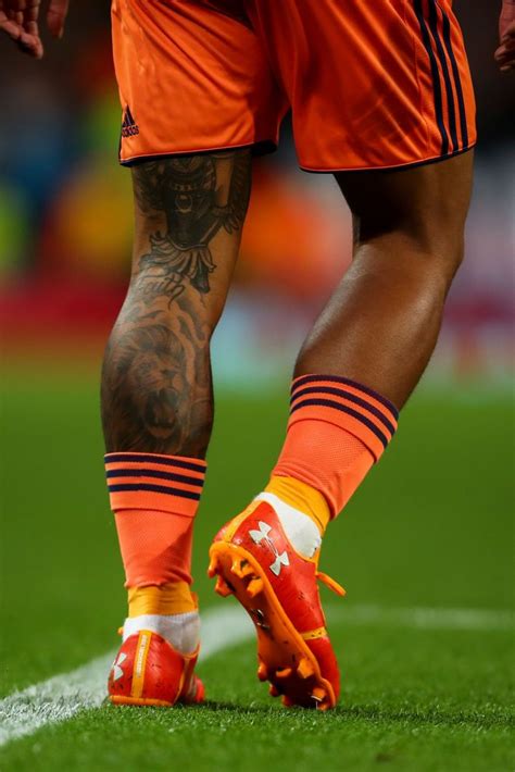 The dutch winger had to be silent for 24 hours for a lion's head tattoo to be created on his back. Tattoos are seen on the legs of Memphis Depay of Olympique ...