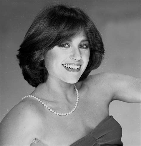 Dorothy wears a white jacket in this picture which is very we need more hairdressers who can cut and style the original dorothy hamill haircut from the 70's. Picture of Dorothy Hamill