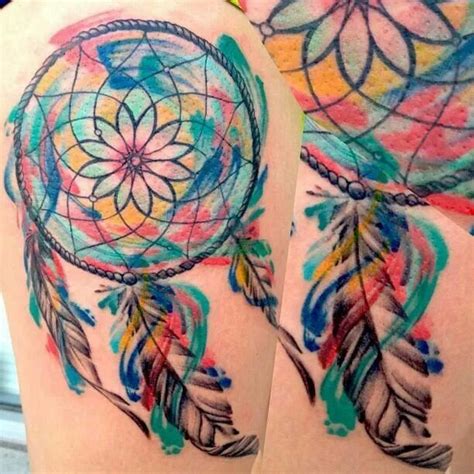 The talisman features beautiful colors, feathers, pearls, wood, and many other ornaments. Beautiful | Watercolor dreamcatcher tattoo, Dream catcher ...