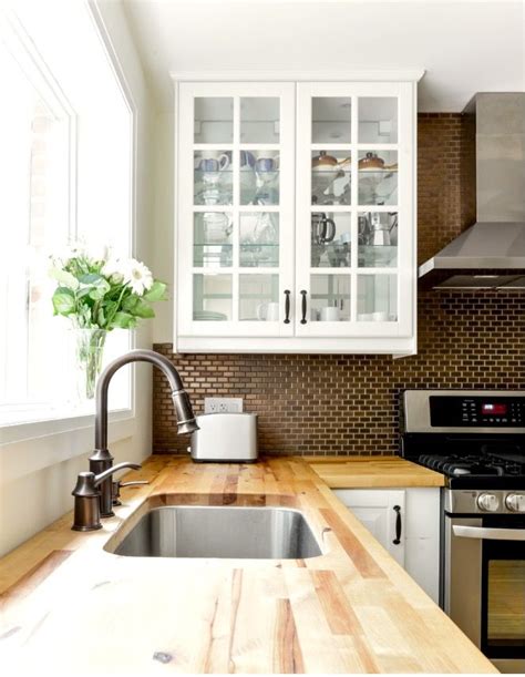 Classic white cabinets give you the perfect clean slate to design your dream kitchen. white and wood | Home, Kitchen reno, Wooden cabinets