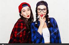 tongue girl girls fun fingers cunnilingus between hipster two twins funny stock stick sign teenager emotional isolated faces grey summer