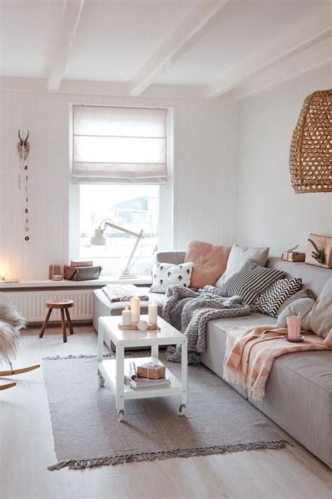 Even an old grey sofa can be enlivened with the pink trend by throwing on a few new scatter cushions and a bright throw. How To Decorate A Grey and Blush Pink Living Room | Decoholic