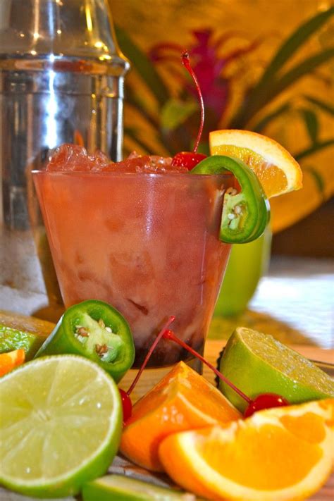 Fresh strawberries, orange liqueur, tequila—and a dash of fiery sriracha sauce. Spicy Tequila Sunrise www.prettybitchescancooktoo.com ...