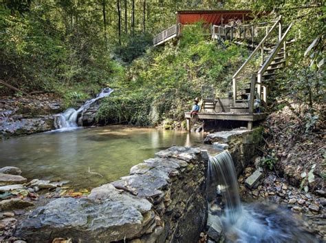 Lake lure hideaway log cabin vacation home rental in riverbend, lake lure nc. Retaining wall built to capture creek making a small pool ...