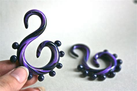 So pleased. check the radians moulded earplugs here. Purple Swirl Polymer Gauged Earrings. $25.00, via Etsy. (With images) | Diy ear plugs, Polymer ...
