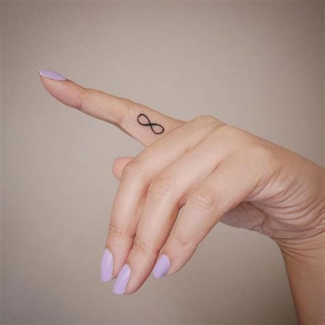 I love the added feminity to this tattoo idea! 80 Inner & Side Finger Tattoos with Meaning for Men & Girls