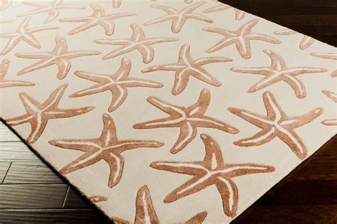 The wool give the feeling of walking on a pebbled beach when stepping on the rug barefoot. Hand Tufted Ivory Wool Starfish Area Rug | Wool runner rug ...