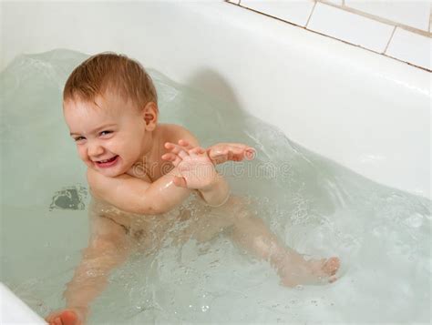 Foldable & portable:portable collapsible bathtub for baby. Happy toddler in bathtub stock photo. Image of ...