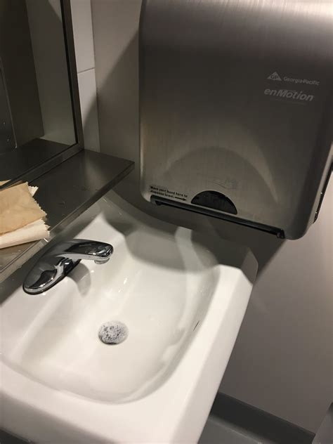 Saying that vessel sinks will not drain properly because they do not have an overflow is a bit like seeing two red cars get into an accident, and cleaning/drain cleaning chemicals caught in that cavity may damage the sink material. Paper towels dispense into the wet sink at Golden 1 Center : CrappyDesign