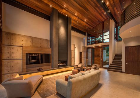 This double height living room turns the entire home into an open plan space, and the effect is brilliant. Beige floor tile and concrete panels in the living room ...