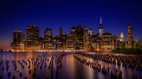 Brooklyn (its name as borough of the city of new york; Brooklyn Bridge Park with Manhattan skyline during night ...