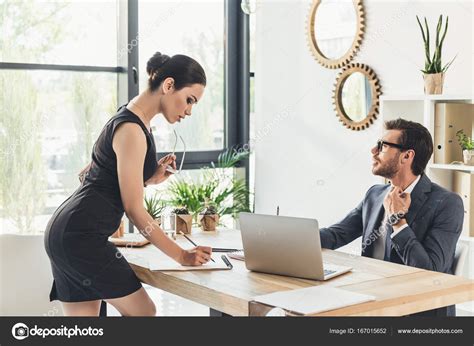 The headmaster will contact you. Seductive secretery leaning over desk — Stock Photo ...