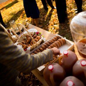 The tree's live edges are basically untouched—the bark was removed because it would fall. Wood Slab Centerpieces with Pine Cones