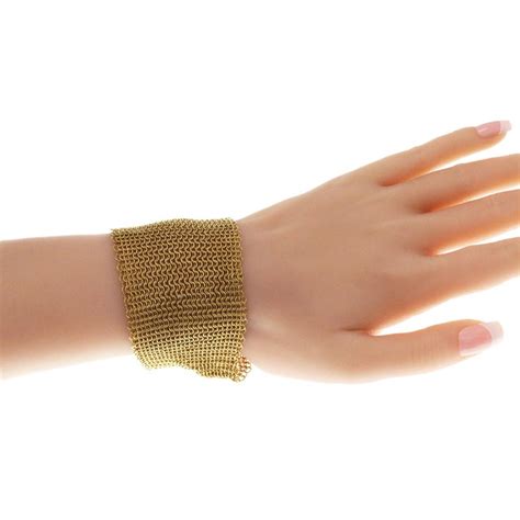 How much is 81 grams of gold. Tiffany and Co. Elsa Peretti 81 Grams 18 Karat Yellow Gold Mesh Bracelet For Sale at 1stdibs