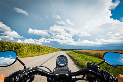 Harleys were design like riding a horse, it's riding position is very similar, it was designed to be a stout no nonsense cruising machine, dependable. Riding A Harley Stock Photo - Download Image Now - iStock