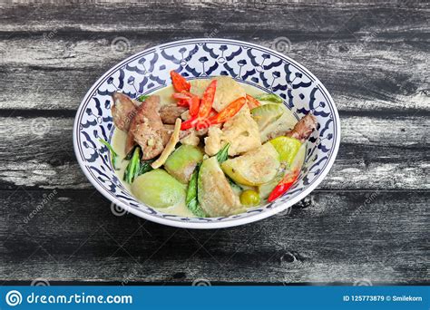 Heat the curry paste in the oil about 30 seconds. Green Chicken Curry In Coconut Milk With Eggplant . Stock ...