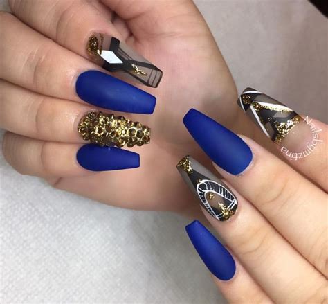 Matte royal blue & gold rhinestones | Gold acrylic nails ... The blue is a pure color that stands for trust, faith, and intelligence.