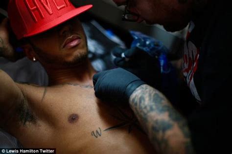 Allan clarke on twitter lewis hamilton has god is love. Lewis Hamilton unveils giant new African lion tattoo on ...