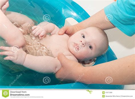 The best baby bathtubs are comfortable, efficient, portable, and safe. Cute baby in bath stock image. Image of bathe, face ...