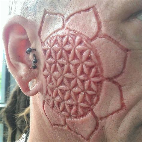 .act, scarification is now routinely carried out with a massive variety of designs just like tattooing scarification can also be used to cover old scars; Scarification By: Justin Zane | Scarification tattoo ...