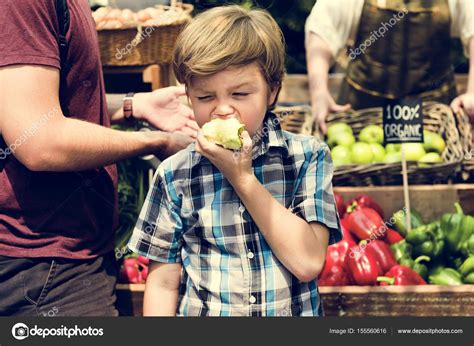 Search and download apple photos for your project with pxbee. Boy Biting Apple — Stock Photo © Rawpixel #155560616