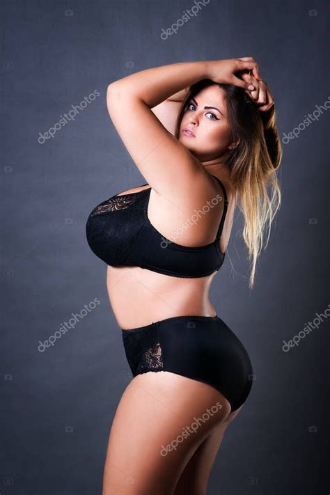 Wear a size 14 or above. Plus size sexy model in black underwear, fat woman on gray ...