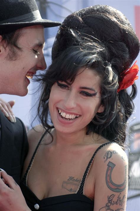 She received her first guitar at age 13 and taught herself how to play. Amy Winehouse concert to mark anniversary of her death