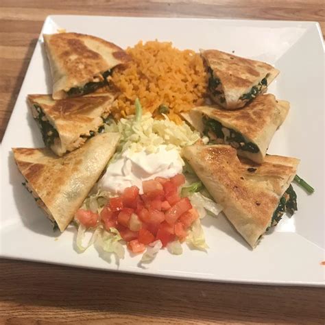 Grilled chicken, melted cheese, chorizo sausage and pineapple served over a flour tortilla with mexican rice, lettuce, sour cream, tomatoes and cheese. Tres Potrillos 85... - Tres Potrillos Mexican Restaurant
