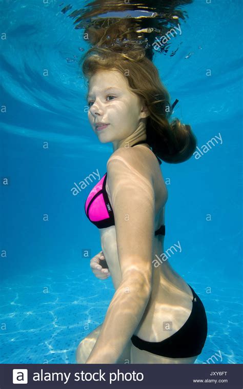 Latex cisara flexible posing 2475 min. Beautiful teen girl posing under water in the pool Stock ...