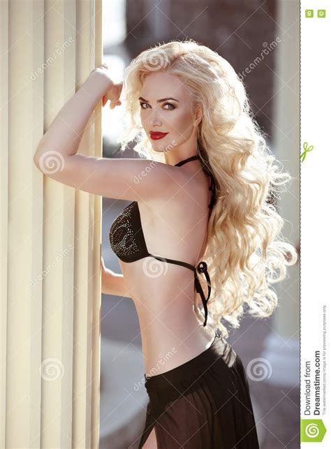 You can use bobby pins to secure one of the sides. Long Wavy Hair. Beautiful Woman Model In Black Bikini ...