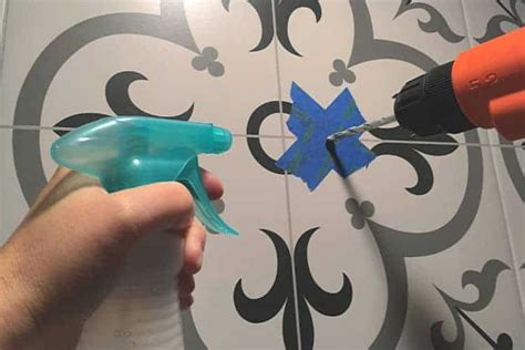 Put a drop sheet down to protect your floor. Drilling-Into-Tile-Drill-and-Water - The Palette Muse