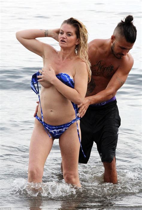 Hubby wants his wife screwed. Pregnant Danniella Westbrook hits beach in bikini in Spain ...