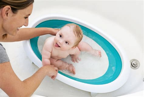 Does anyone know when it is safe to submerge baby's ears in water when bathing? The only baby bathtubs you want to bathe your baby in